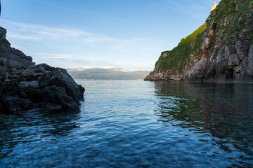 KRK Island, Vrbnik, Croatia - April 19, 2025: Panorama of mountains and water. Beautiful mountain horizon with cliffs and sea.