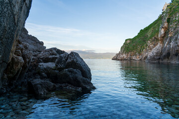 KRK Island, Vrbnik, Croatia - April 19, 2025: Panorama of mountains and water. Beautiful mountain horizon with cliffs and sea.