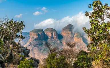 A tree framed view towards three Rondavels in Blyde River Canyon,  Mpumalanga, South Africa in Springtime