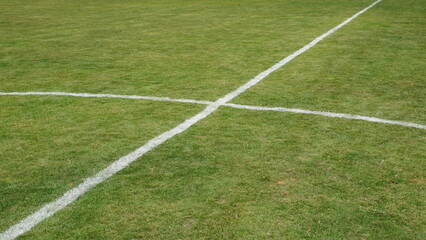 Obraz premium Crisp White Line Intersection On Turf