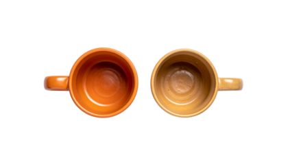 Two terracotta mugs rustic ceramic cups for coffee or tea isolated on transparent background