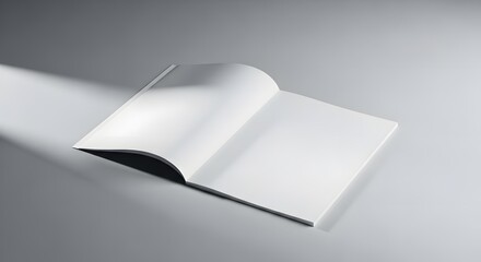 Open blank white book or magazine on a grey surface