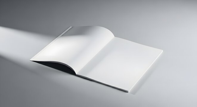 Open blank white book or magazine on a grey surface