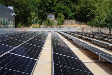 Solar panels on the ground in the mountains in Albania. Photovoltaic energy generation in Albania.