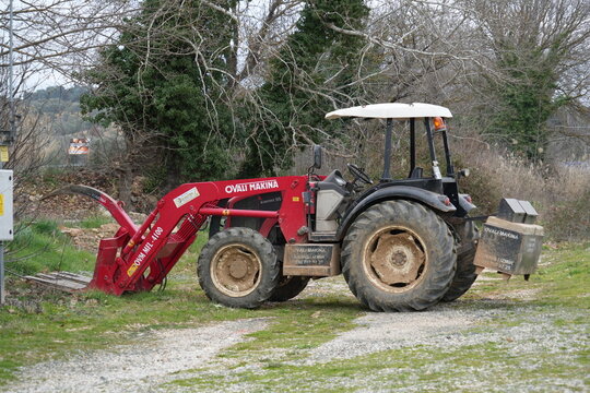 A red Ovali Makina Kismet 55 tractor. Aphrodisias, Aydin, Turkey, February 2025. 