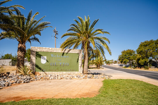 The Outjo Welcome Sign in Namibia greets travelers with palm-lined charm