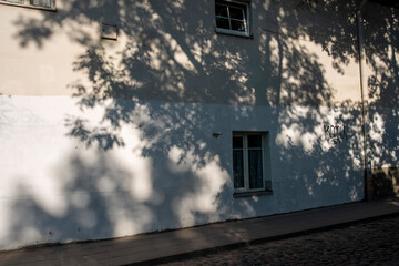 old house in the city shadows summer dappled