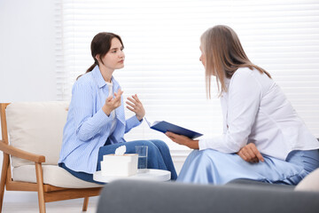 Professional psychotherapist working with patient in office
