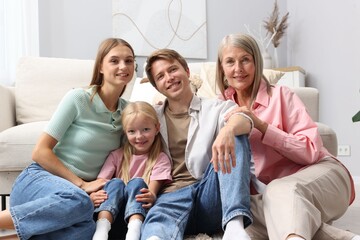 Senior woman with her son's family at home