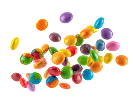 Colorful round candies in mid-air