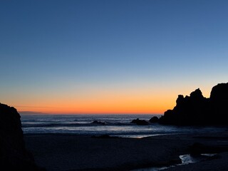 Sunset at Pfeiffer Beach. Purple sand beach at highway 1, Big Sur, California.