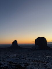 Snow-covered Monument valley at sunrise.
