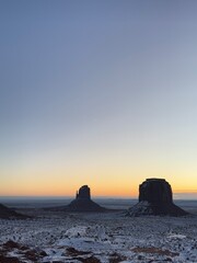 Snow-covered Monument valley at sunrise.