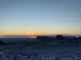 Snow-covered Monument valley at sunrise.