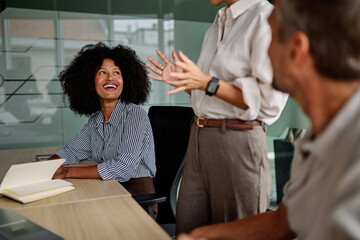 Portrait of a group of business people having a meeting in the office. Teamwork and success concept, portrait of a smart businesswoman
