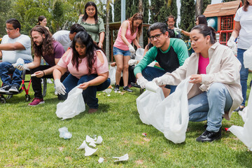 Group of diverse Latin people collecting trash in a public park in Mexico, Latin America. Group of multi age Hispanic volunteers cleaning up and collecting plastic in save the planet concept