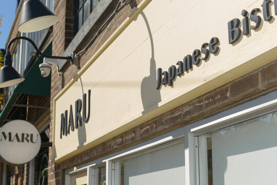 exterior sign at MARU Japanese Bistro located at 1402 Queen St E, Toronto