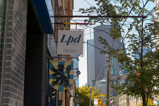 projecting signs outside Petit Dejeuner by LPD Caf&eacute;, a breakfast restaurant, located at 191 King St E, Toronto