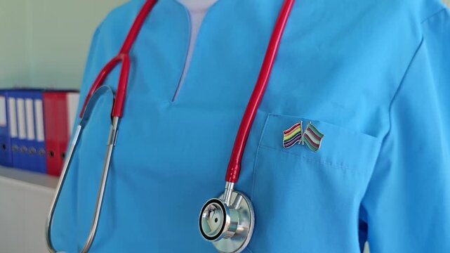 Nurse prepares for shift in bright blue scrubs with a stethoscope ready