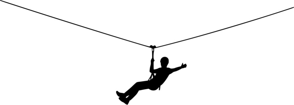 Silhouette of a person ziplining through the air enjoying outdoor adventure activities.
