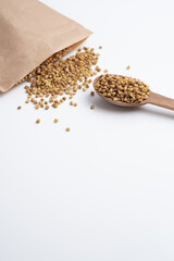 Buckwheat tea, herbs on a wooden board with a spoon. Tea ceremony. Herbal treatment.