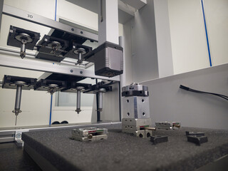 Advanced robotic equipment conducting precision assembly in a cleanroom environment during daytime