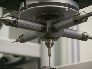 Precision technology in action with a multi-axis machining tool in a manufacturing facility