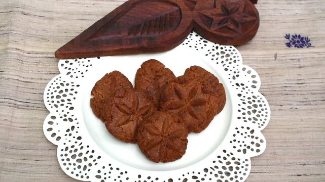 Thekua in plate with wooden mold.