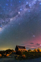 Milky Way, Nebula, Aurora Australis glowing over Church of the Good Shepherd at Lake Tekapo, New...