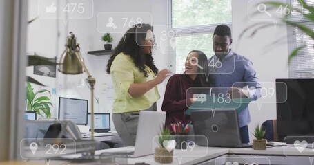 Opening folder and high-fiving, colleagues viewing social media metrics icons celebrating progress - Powered by Adobe