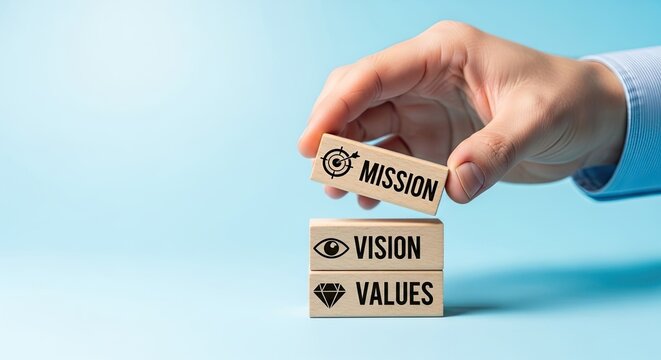 Caucasian hand placing mission wooden block on vision values blocks