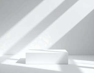 White minimalist product display podium illuminated by sunlight