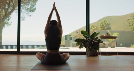 Meditation, woman and mindfulness in home, yoga and wellness on floor, back and calm in living room. Healthy, routine and person on mat for self awareness, zen and sukasana with inner peace benefits