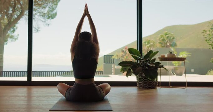 Meditation, woman and mindfulness in home, yoga and wellness on floor, back and calm in living room. Healthy, routine and person on mat for self awareness, zen and sukasana with inner peace benefits