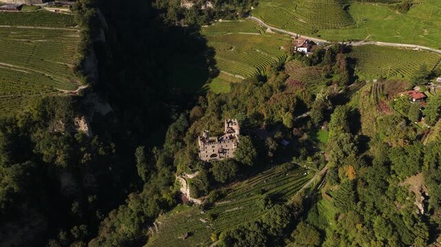 Brunnenburg castle on alpine slopes in Tirol, Italy.