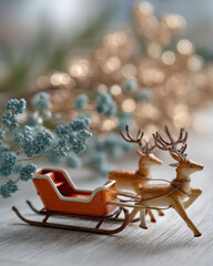 Vintage toy sleigh with two reindeer, surrounded by decorative foliage and soft bokeh lights, creating a festive and nostalgic holiday atmosphere