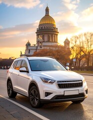 White SUV parked in front of a cathedral at sunset
