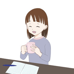 マグカップを持って勉強を休憩する女の子