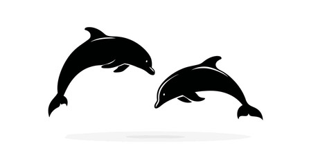 Two graceful black dolphins leaping against a clean white background, with a subtle shadow