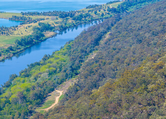 Drone aerial photograph of the Nepean River and large water reservoirs in the Cumberland Plain region of Hawkesbury Heights looking towards Penrith in NSW, Australia.