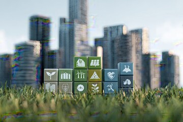 Miniature blocks with environmental icons sit in grass against a backdrop of blurred city buildings