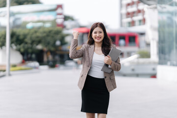 Successful Businesswoman Celebrating in City