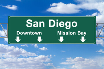 A green freeway sign for San Diego with arrows pointing to Downtown and Mission Bay