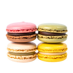 Close-up of four colorful, stacked sandwich cookies with cream fillings, isolated on black