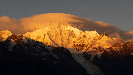 Fototapeta premium Golden sunlight on mountain peak