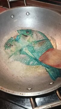 Frying Daing na Isda in Hot Oil
