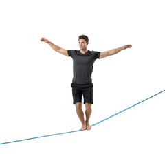 Young Athletic Man Balancing Barefoot on Slackline Rope with Arms Outstretched Against Transparent Background