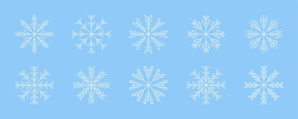Collection of intricate white snowflakes on blue background for winter decoration