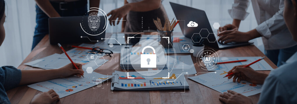 A dynamic business meeting showcasing teamwork with a focus on digital security concepts, highlighting data protection within a modern workspace environment. Trope