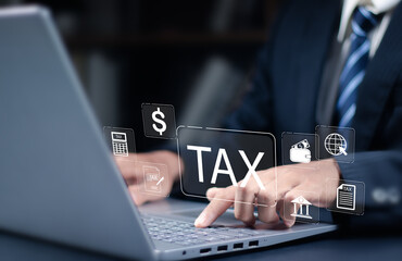 Business concept of fill in the income tax online return form for payment. Business use calculator and laptop calculate government taxes and tax return with financial icon on virtual screens